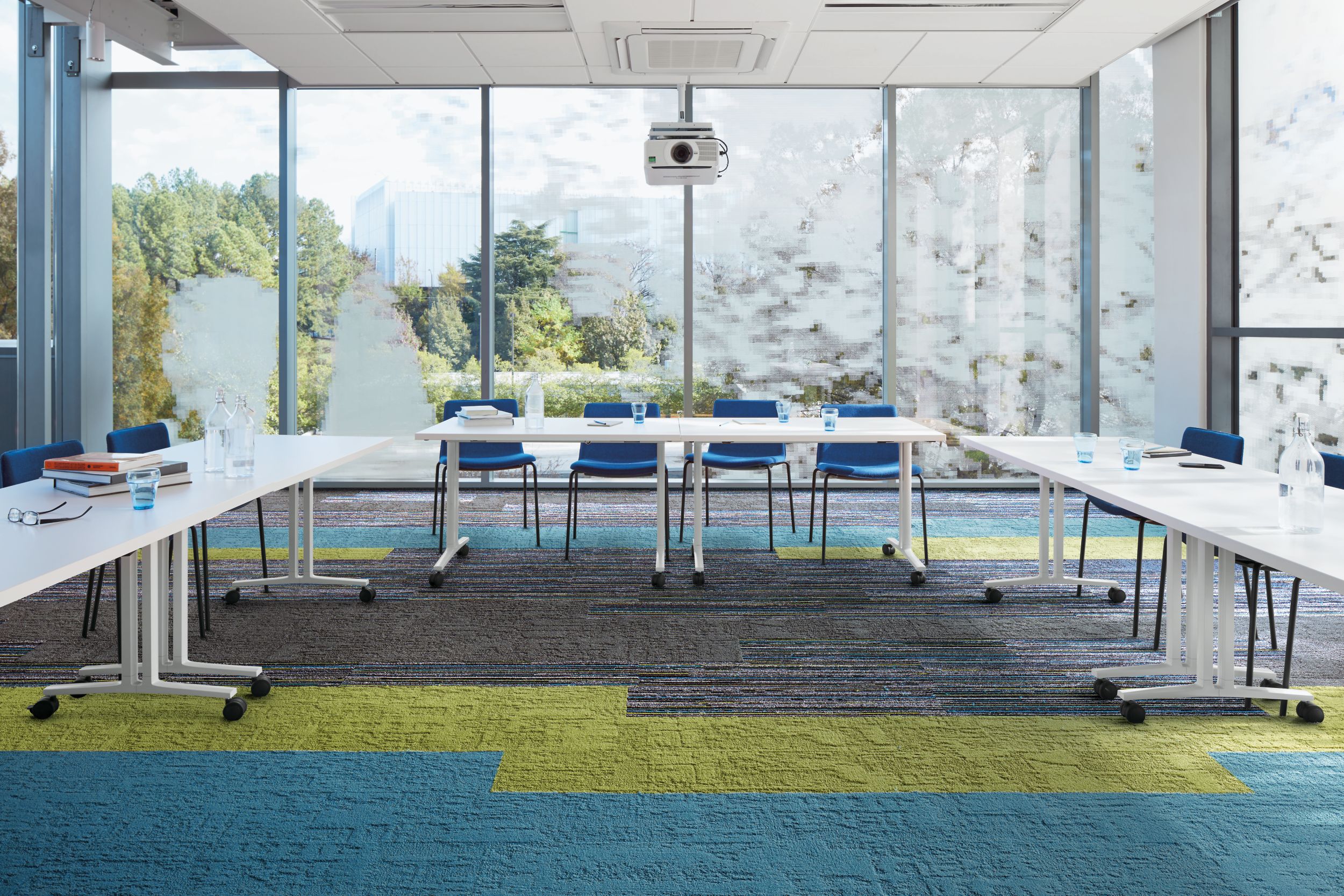 Interface Video Spectrum and Shaded Pigment carpet tile meeting room with large conference table image number 1